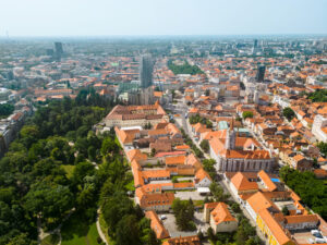 Aerial drone view of Zagreb, Croatia. Historical city centre with multiple old buildings made in national style, Zagreb Cathedral, greenery