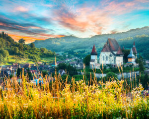 Beautiful medieval architecture of Biertan fortified Saxon church in Romania protected by Unesco World Heritage Site. Amazing sunset in Biertan.Transylvania, Sibiu, Biertan, Romania, Europe.