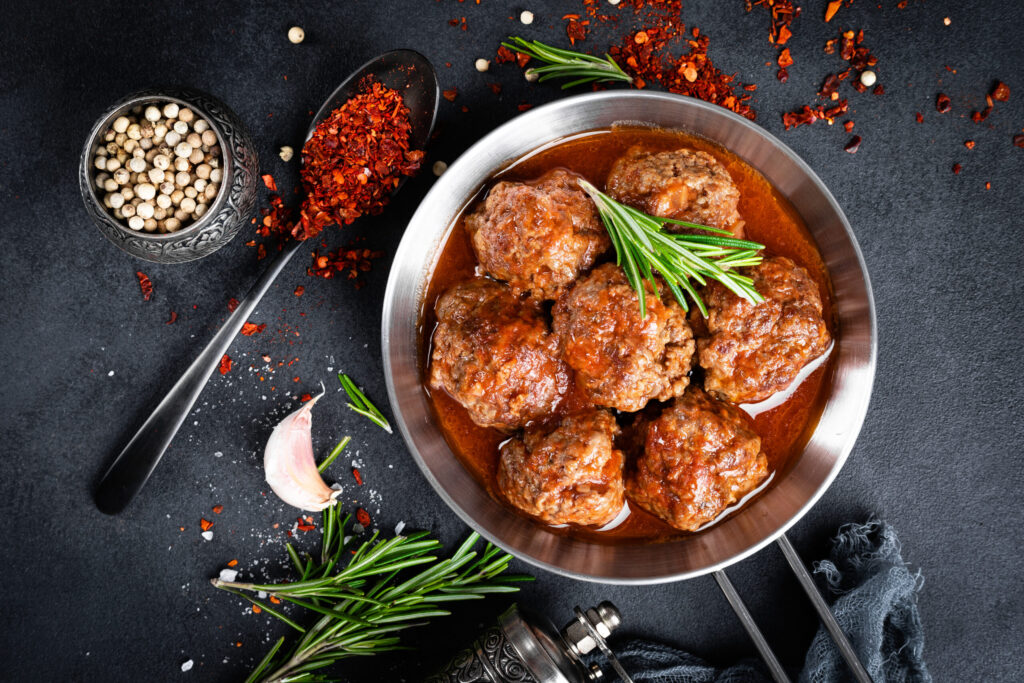 Beef meatballs with spices in tomato sauce
