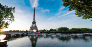 Paris Eiffel Tower and river Seine with sunrise in Paris, France. Eiffel Tower is one of the most iconic landmarks of Paris, web banner format