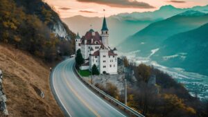 High-angle view of a road going down a hill next to Vaduz Castle in Liechtenstein – picturesque alpine landscape
