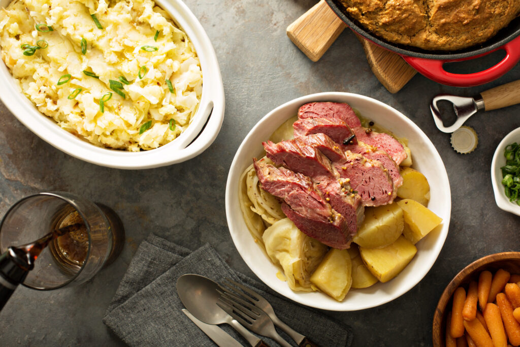 Irish dinner with corned beef and potatoes, colcannon and soda bread