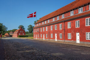 Kastellet fortress buildings (The Citadel) with the flag of Denmark - Copenhagen, Denmark
