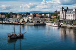 A lot of buildings on the coast of a sea near Akershus Fortress in Oslo, Norway