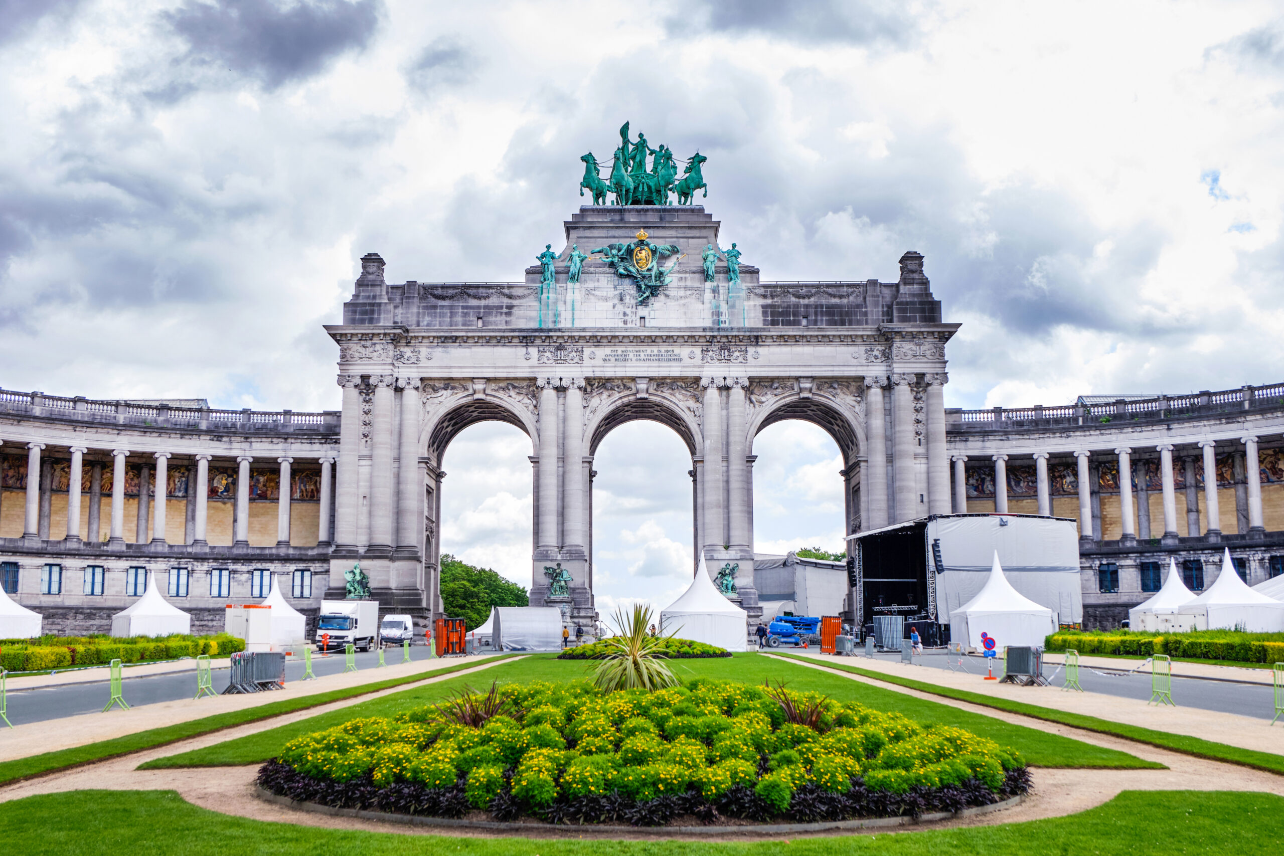 Parc du Cinquantenaire or Jubelpark in a cloudy day. Famous triumphal arch. Brussels, Belgium