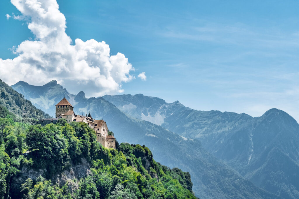 Vaduz Castle, the official residence of the Prince of Liechtenstein, with Alps mountains in background