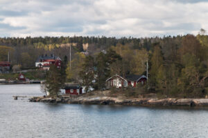 View from the ship to the rocky coast of Sweden – maritime scenery with rugged shoreline