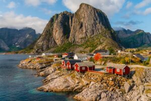 The view of the red cottages by the coastline in Hamnøy, Lofoten Islands, Norway