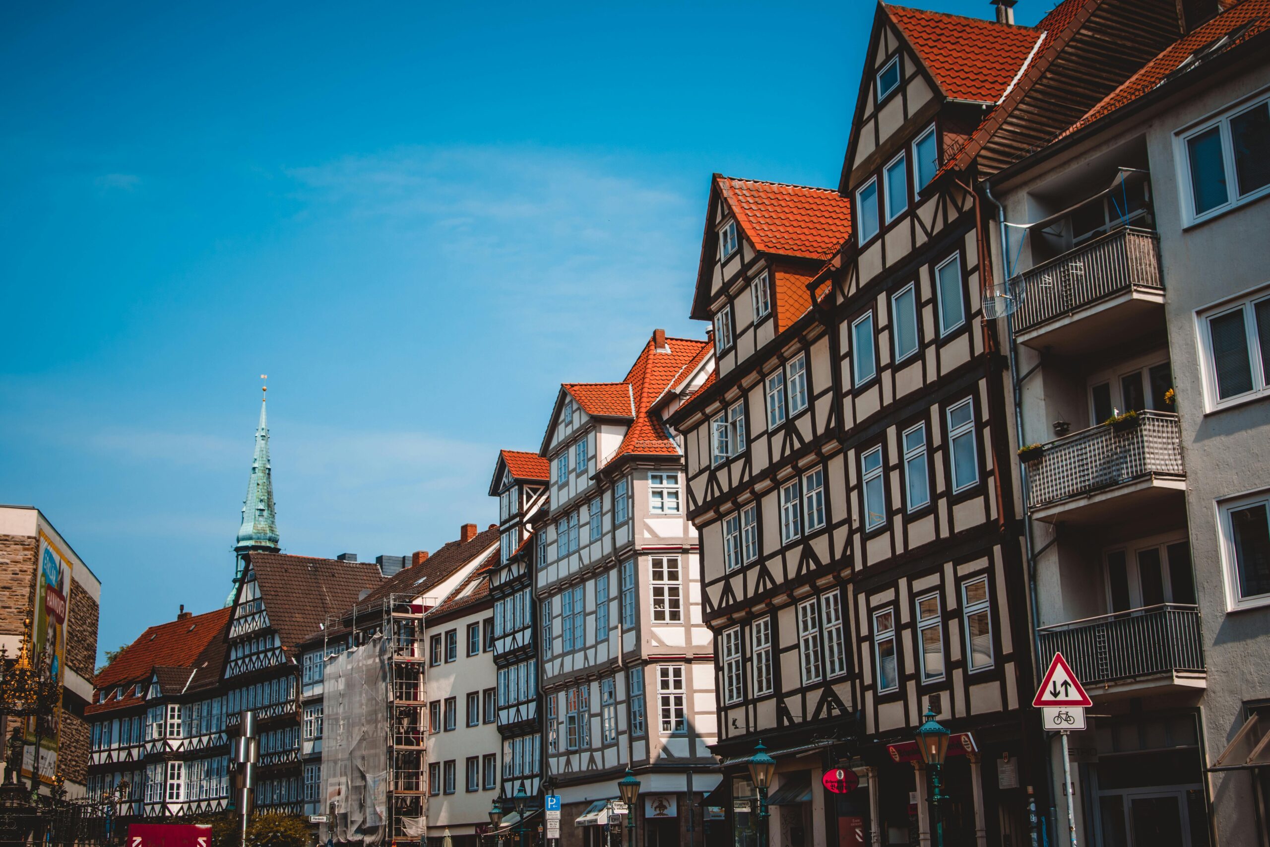 Traditional half-timbered German houses along a street, evoking destinations in a Germany relocation.
