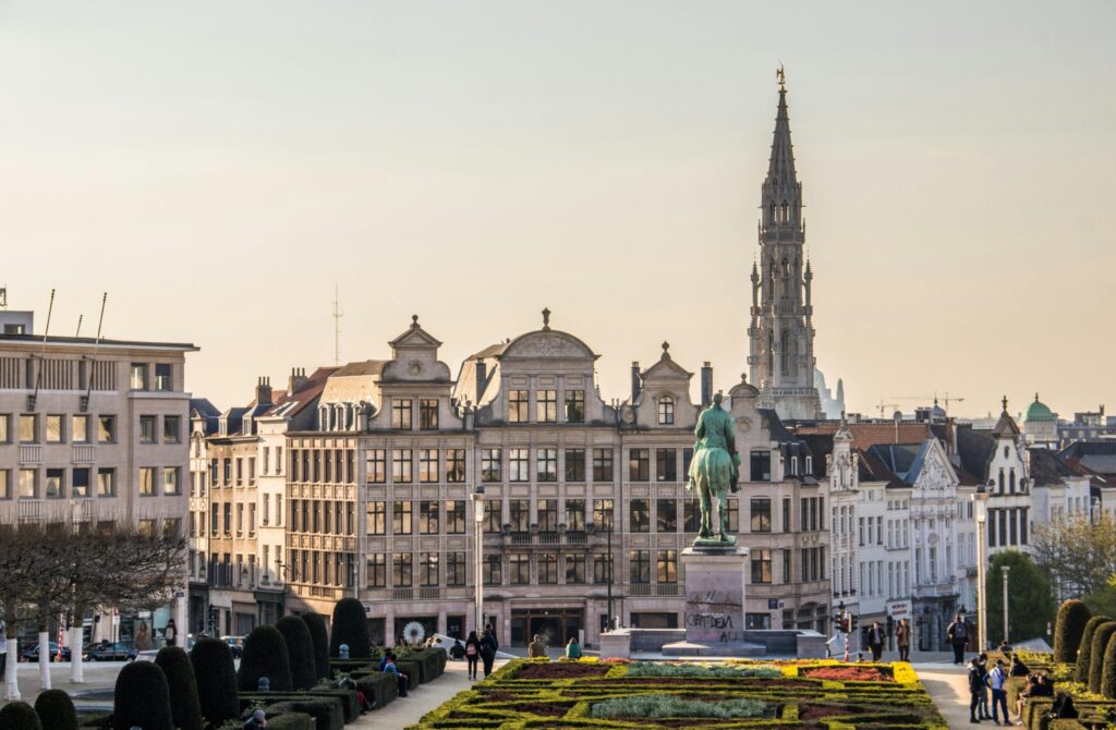 Historical urban charm in Belgium – elegant cityscape with Mont des Arts and medieval tower in Brussels, symbolizing architectural and cultural appeal when comparing living in Belgium vs Netherlands.