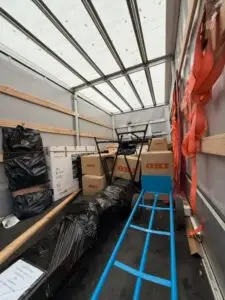 Neatly packed moving truck with secured boxes, bags and equipment prepared for safe European removals with VANonsite