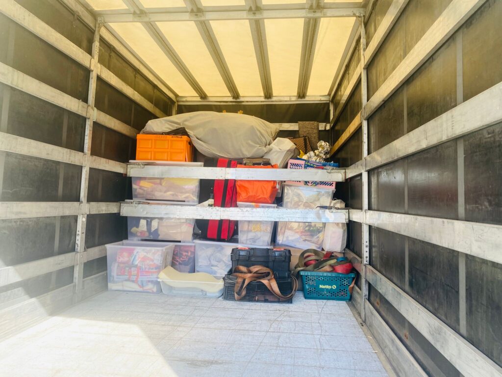 Household items secured inside a removal vehicle for long-distance transport