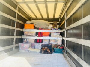 Household items secured inside a removal vehicle for long-distance transport