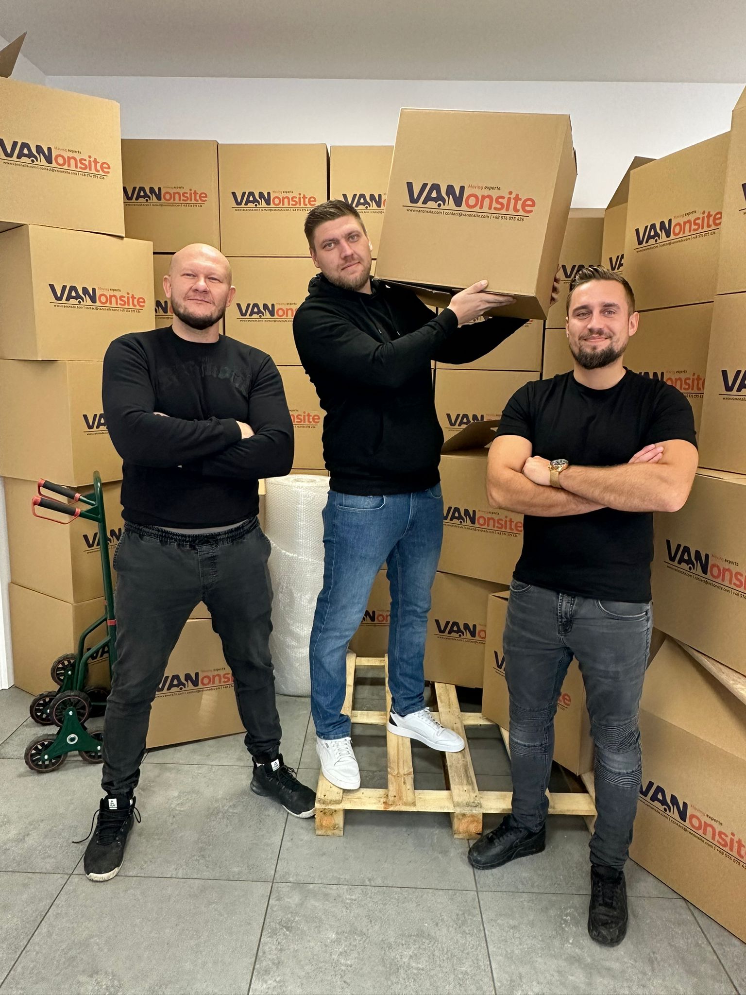 VANonsite removal team with branded moving boxes before a European relocation